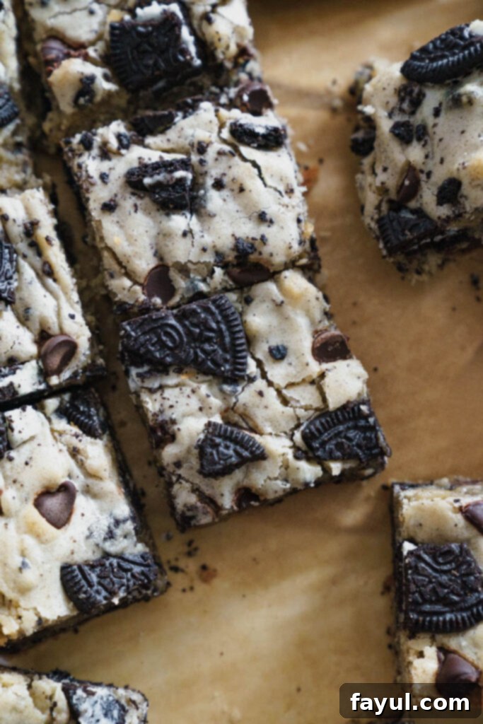 A whole pan of freshly baked Oreo Blondies, golden brown and glistening with chocolate and Oreo pieces on top.