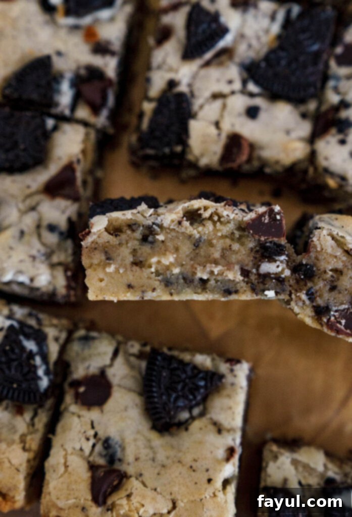 A close-up of the gooey, chewy texture of a single Oreo Blondie bar.