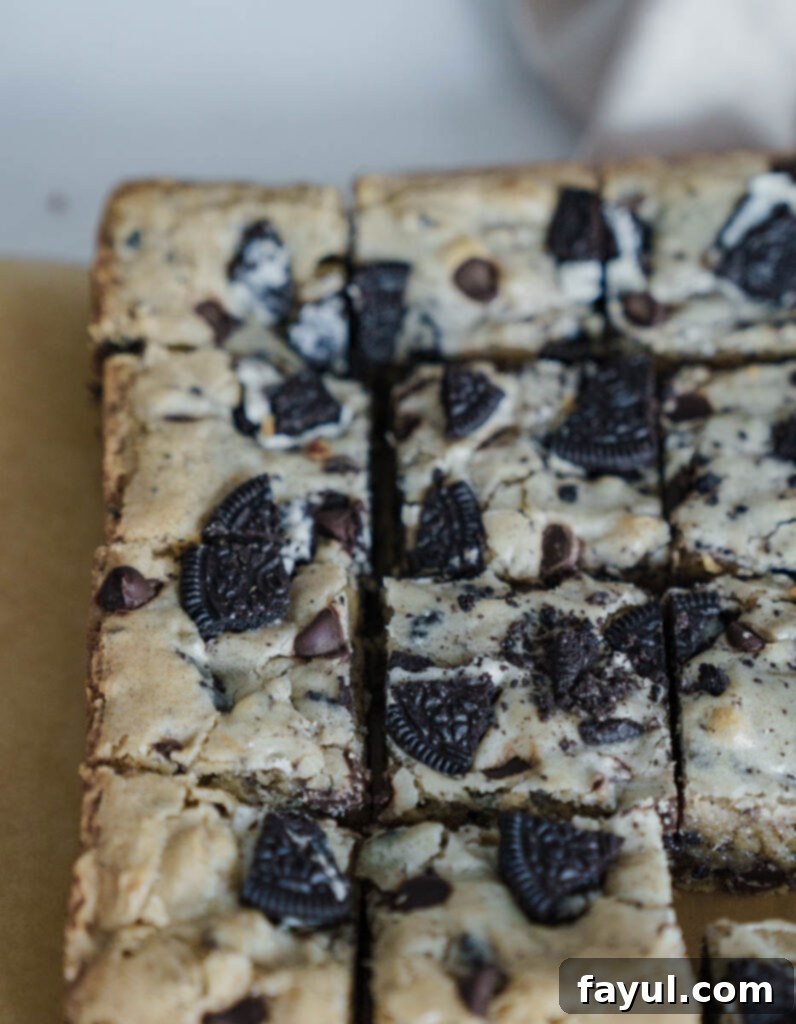 Oreo Blondies with a fork, ready to be enjoyed.