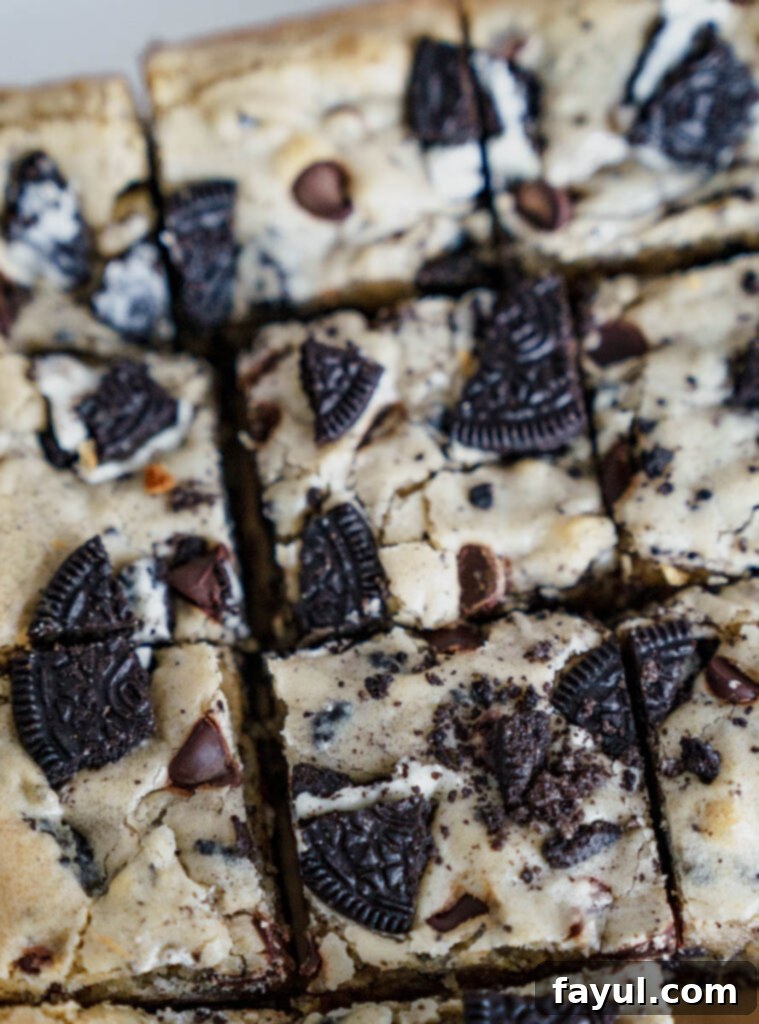 Oreo Blondies in a pan, ready to be cut into squares.