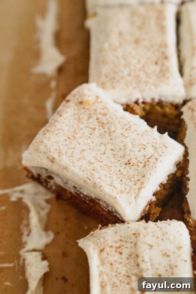 A whole Spice Cake with intricate cream cheese frosting decoration