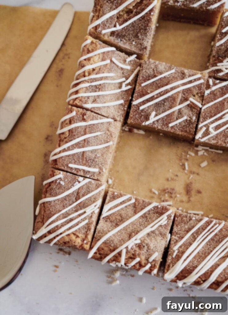 A tray of Cinnamon Roll Blondies before being cut, showcasing the cinnamon sugar swirl.