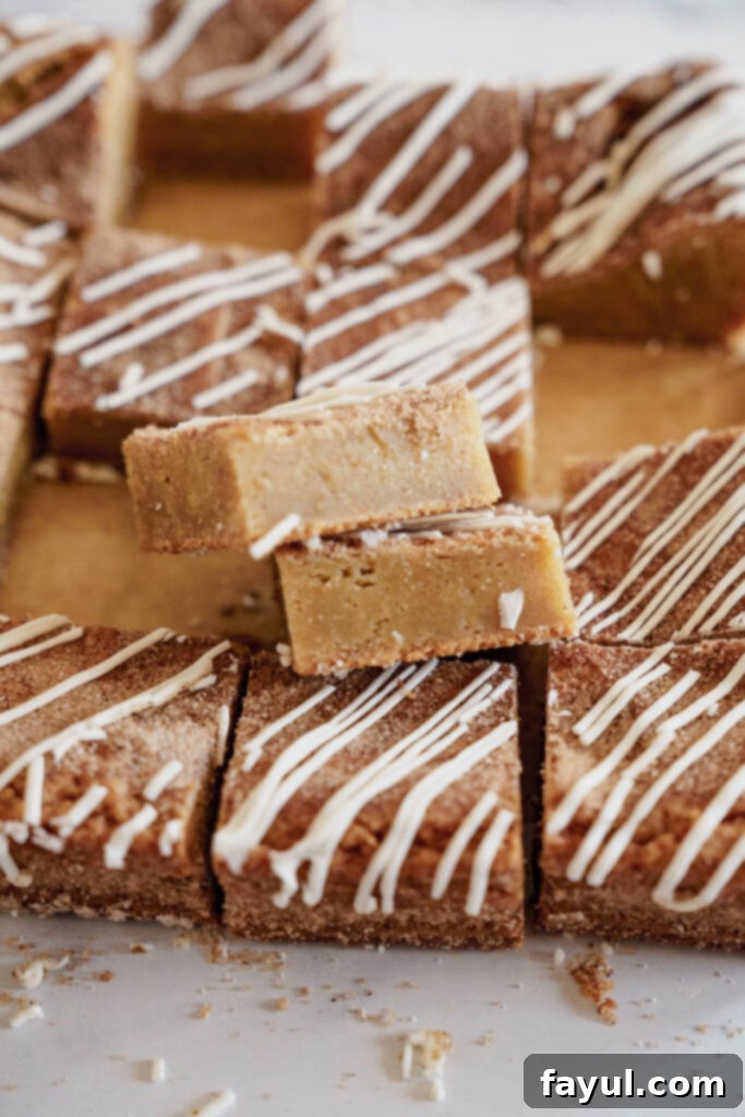 A single Cinnamon Roll Blondie square, perfectly iced and ready to eat.