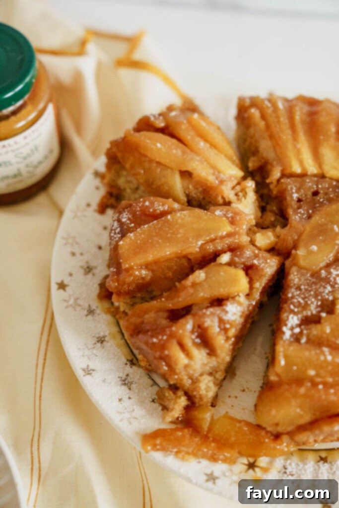 A whole Caramel Apple Upside Down Cake on a cake stand