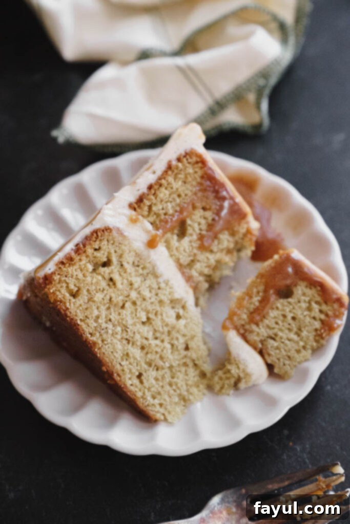 Whole Chai Caramel Cake decorated with frosting and caramel