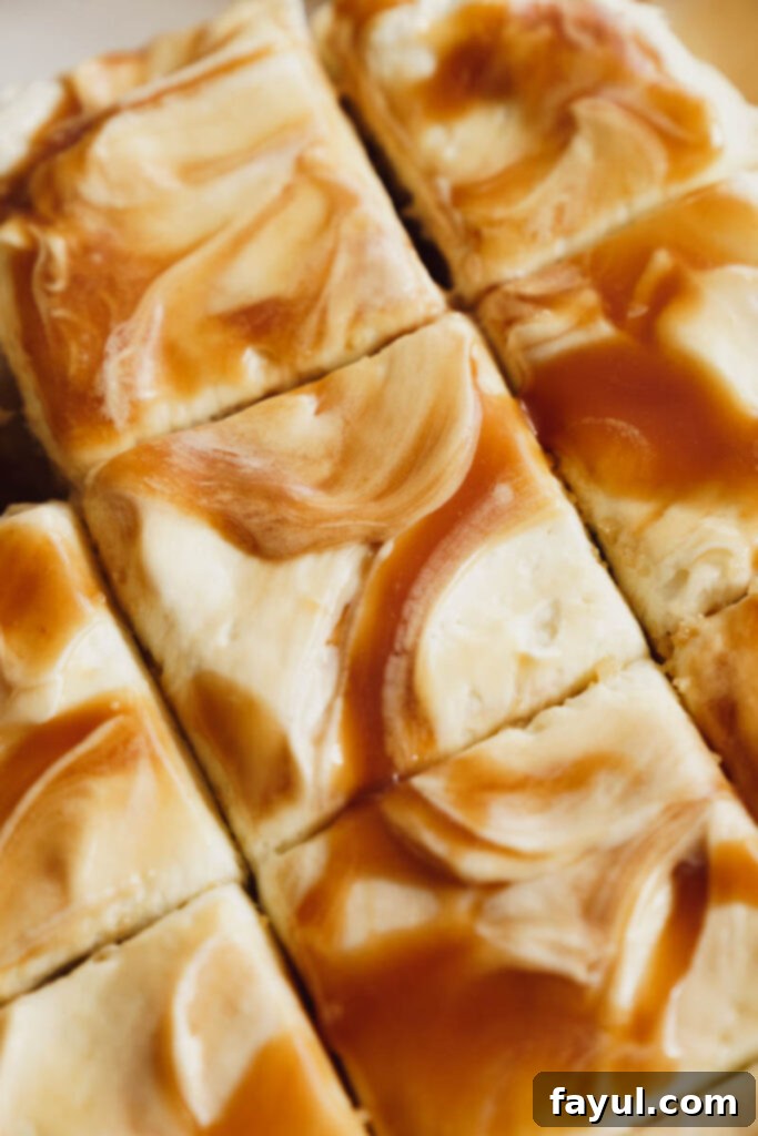 Close-up of a slice of Caramel Apple Cake showing moist layers and caramel swirls