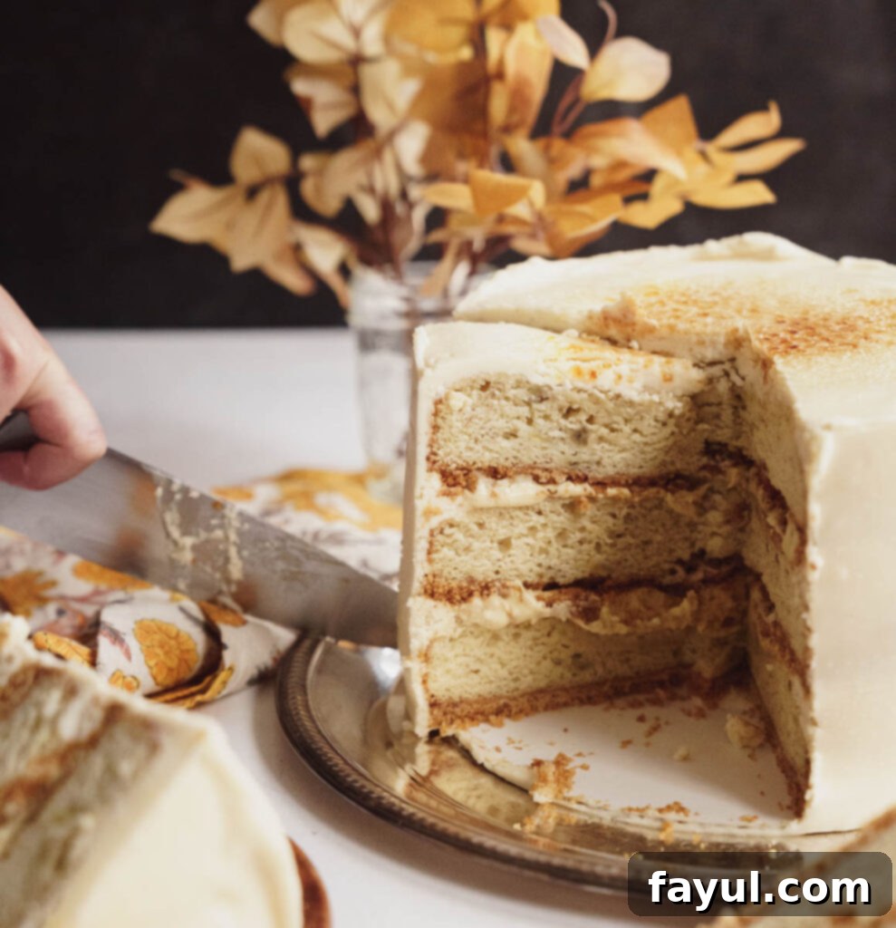 Creamy vanilla buttercream being spread on a cake