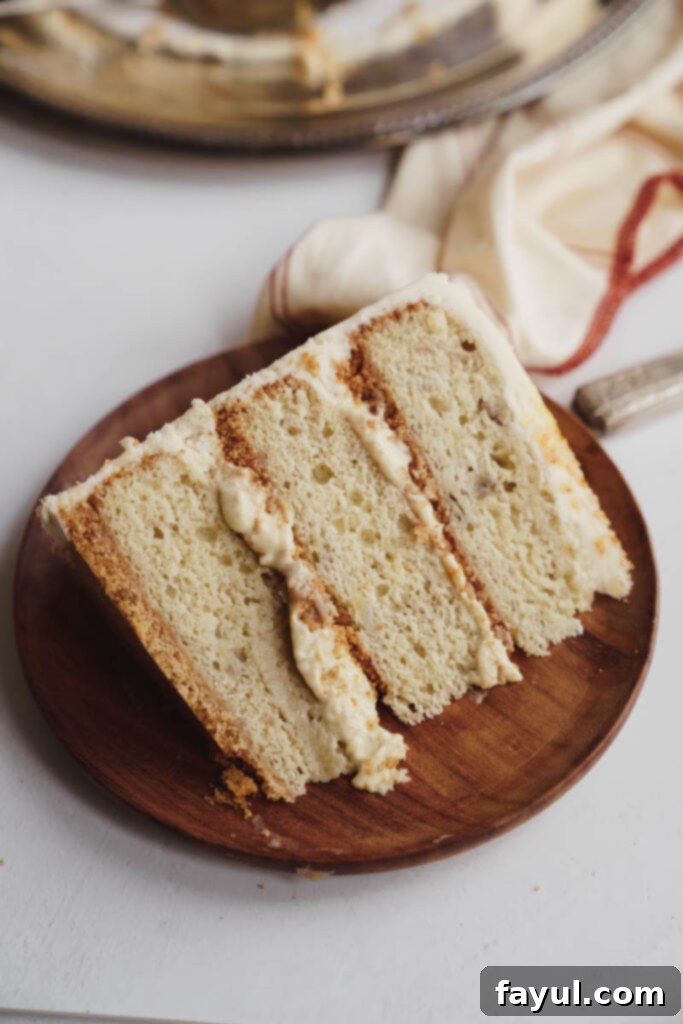 A slice of Banana Creme Brulee Cake on a plate, ready to be enjoyed