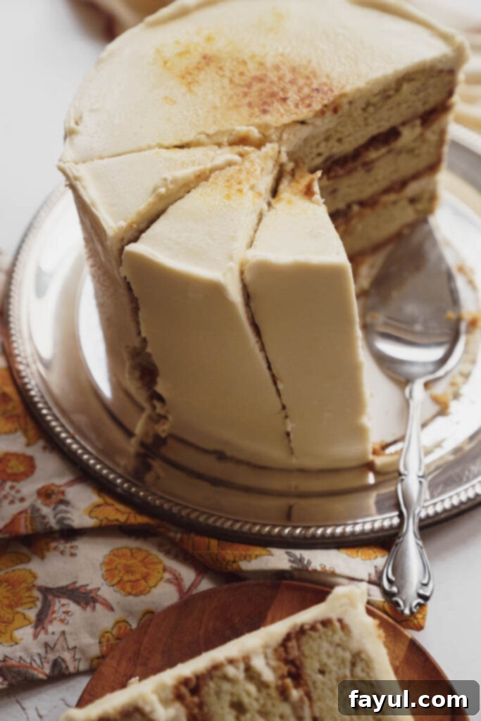 Close-up of a slice of Banana Creme Brulee Cake showing layers and caramel topping