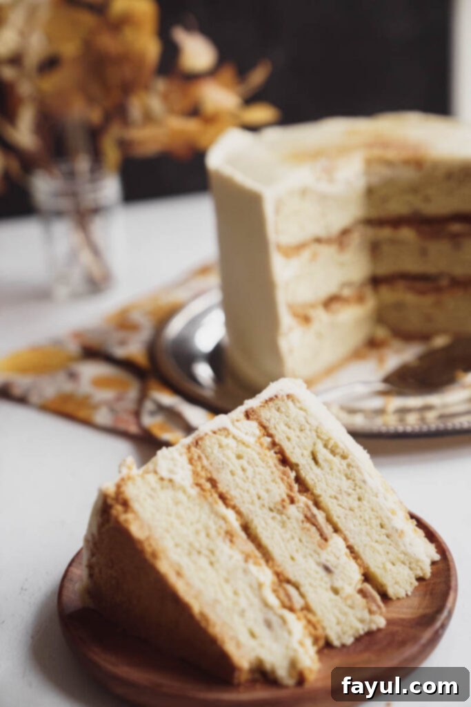 Assembled Banana Creme Brulee Cake layers with frosting