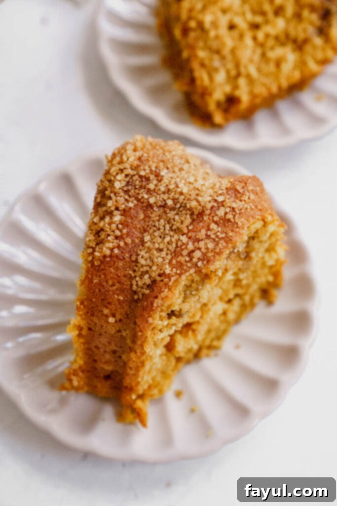 A slice of Pumpkin Churro Bundt Cake being served