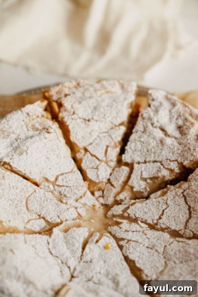 Close-up of Gooey Butter Pumpkin Cake, highlighting its moist texture and rich cream cheese topping.