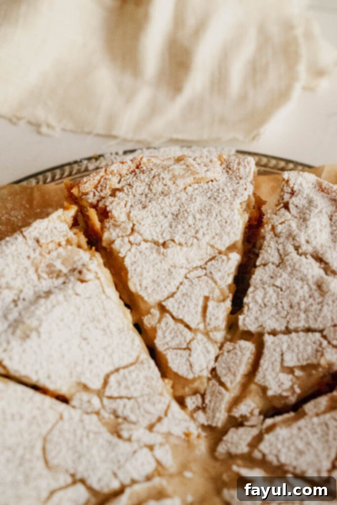 Two slices of Gooey Butter Pumpkin Cake on a plate, ready to be enjoyed.