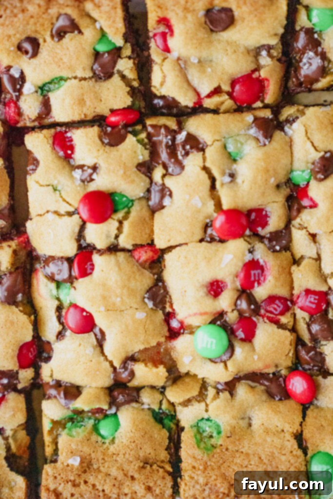 Close-up of a stack of Oreo M&M Blondies, showcasing the layers
