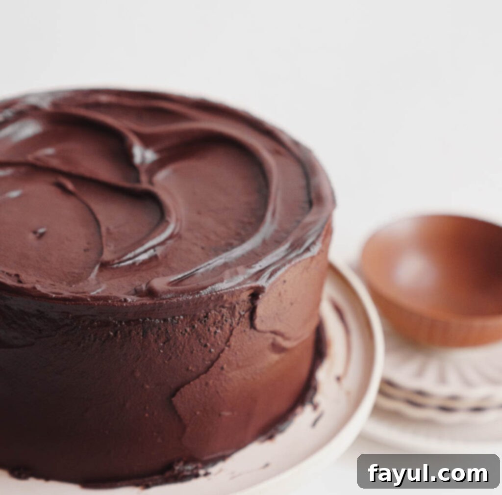 chocolate fudge cake on stand