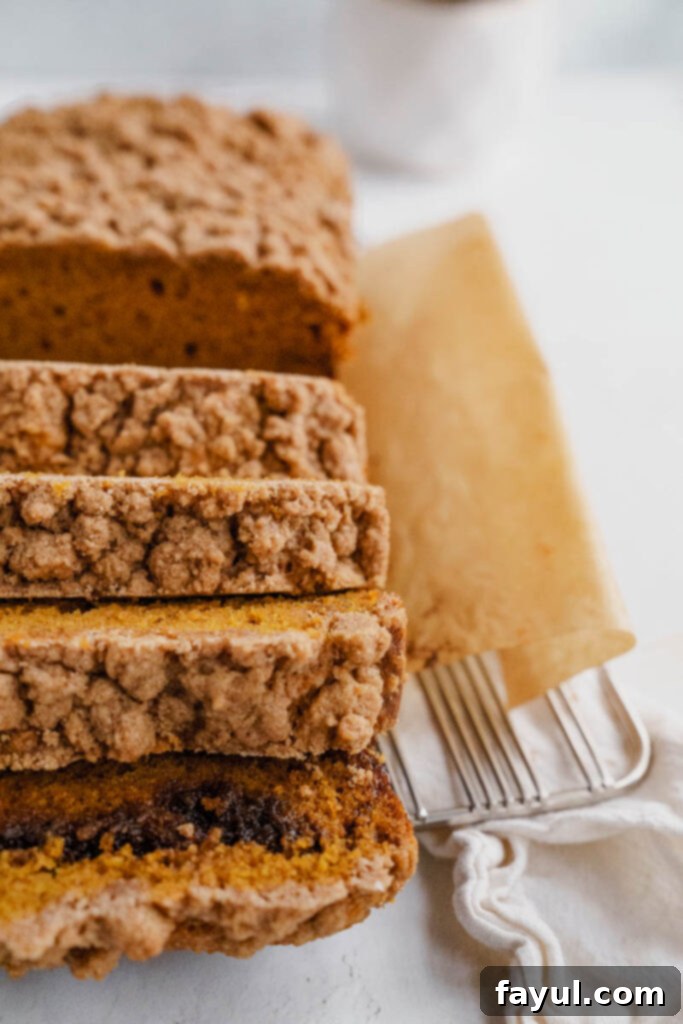Pumpkin bread with streusel actively baking in the oven