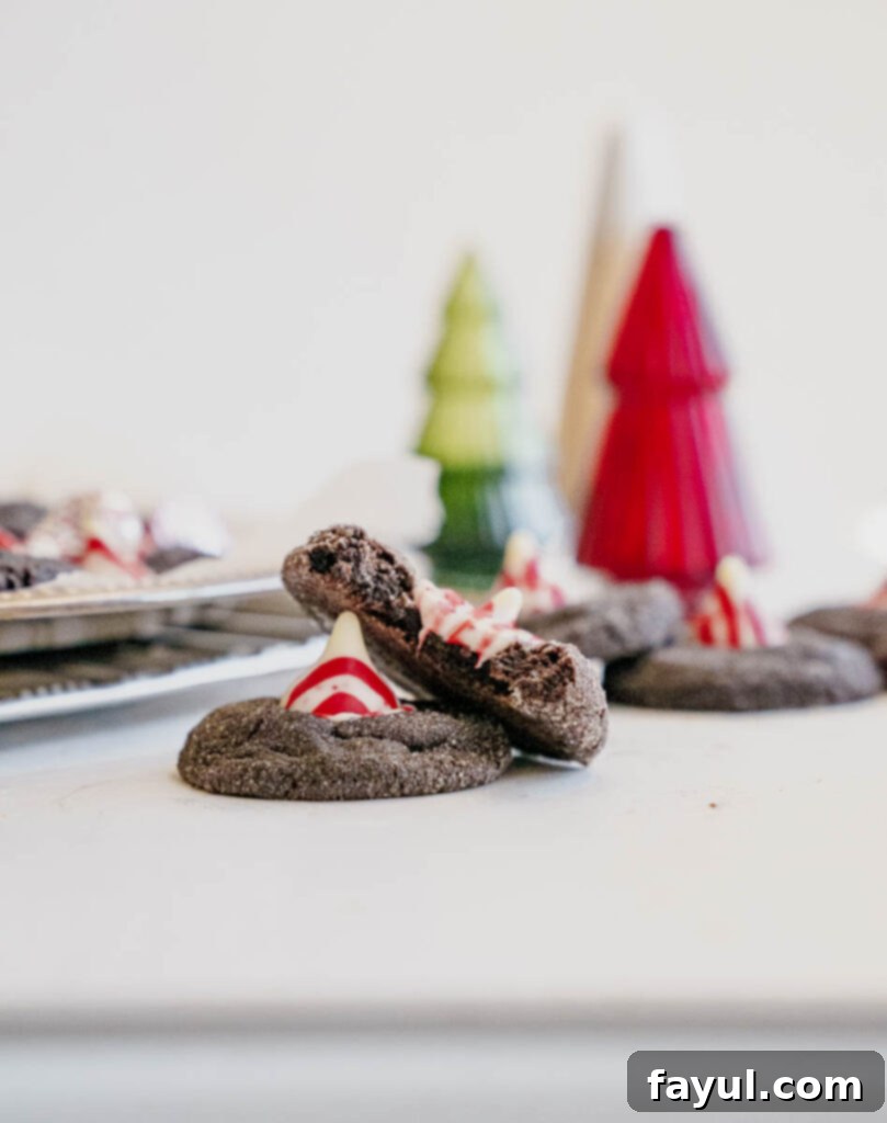 Delicious Peppermint Kiss Chocolate Cookies stacked on a white plate