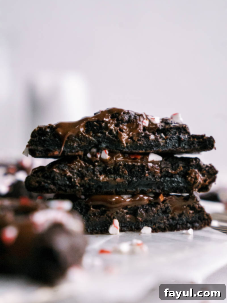 Double Chocolate Peppermint Cookies with crushed candy canes on a cooling rack