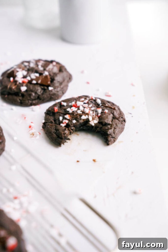 Double Chocolate Peppermint Cookies cooling on parchment paper