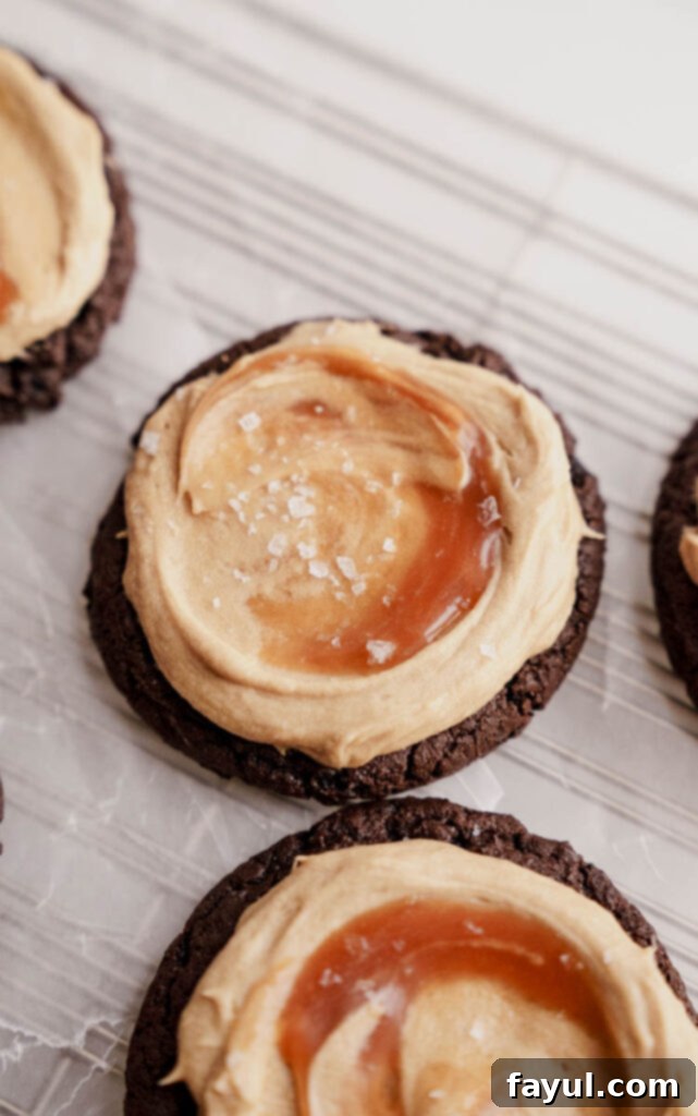 Chocolate salted caramel cookie in hand, showing its deliciousness