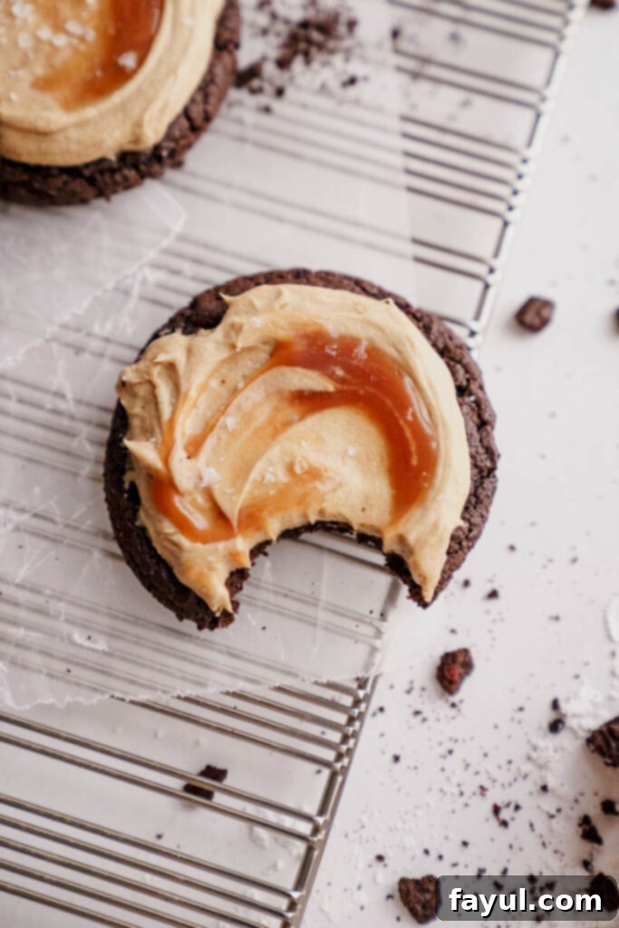 Close-up of a chocolate salted caramel cookie showing its rich texture and frosting