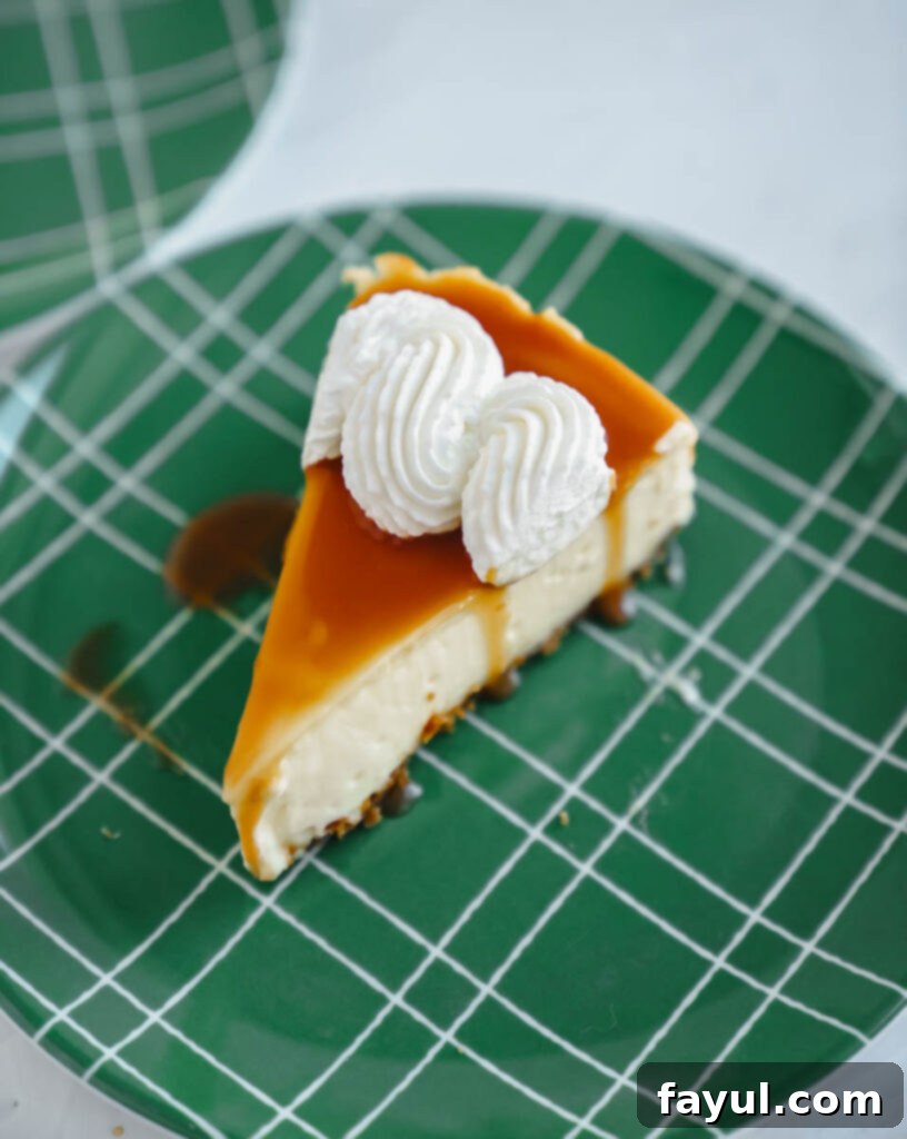 Whole pear cheesecake on a white serving plate