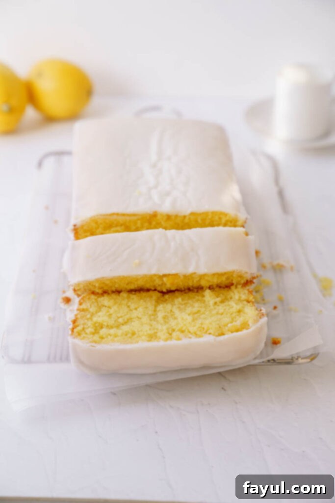 A beautifully sliced lemon loaf with perfect crumb, ready to be enjoyed