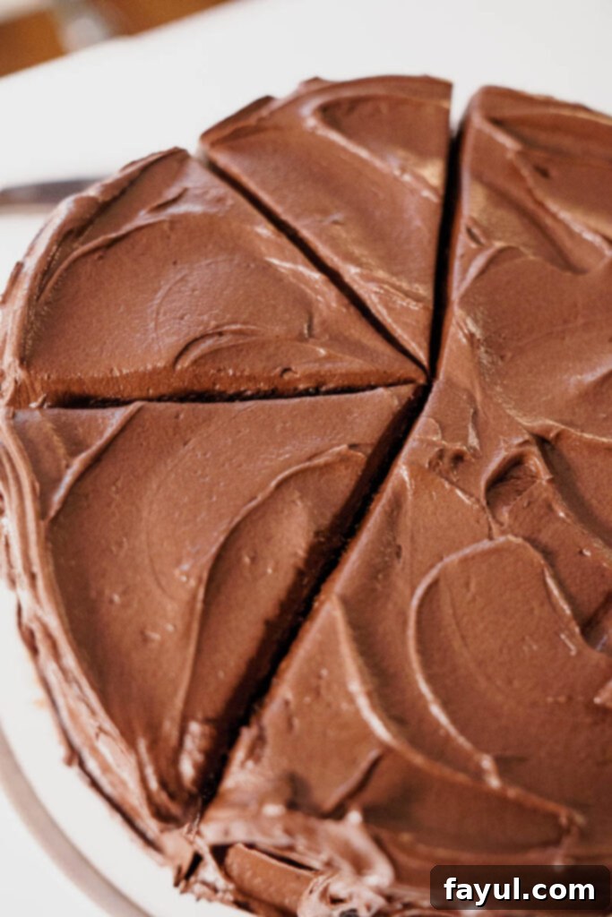 Two baked cake layers cooling on a wire rack.