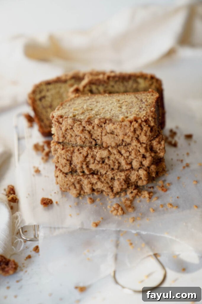 Whole loaf of Banana Bread with Streusel on a cooling rack