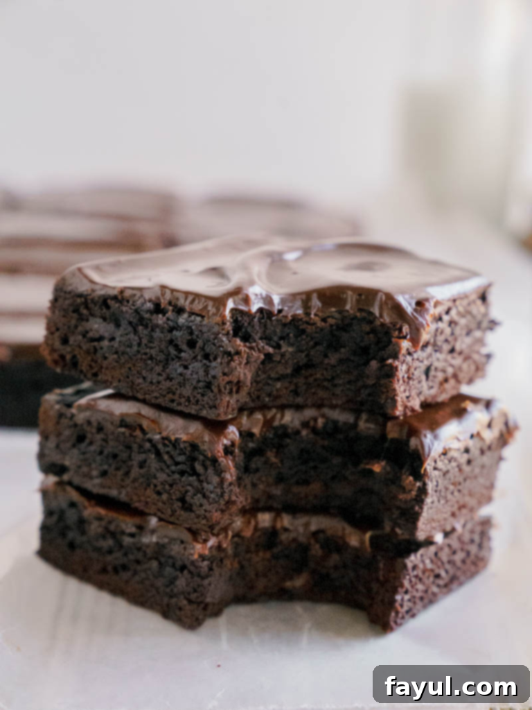 close up of square lunch lady brownies with chocolate frosting