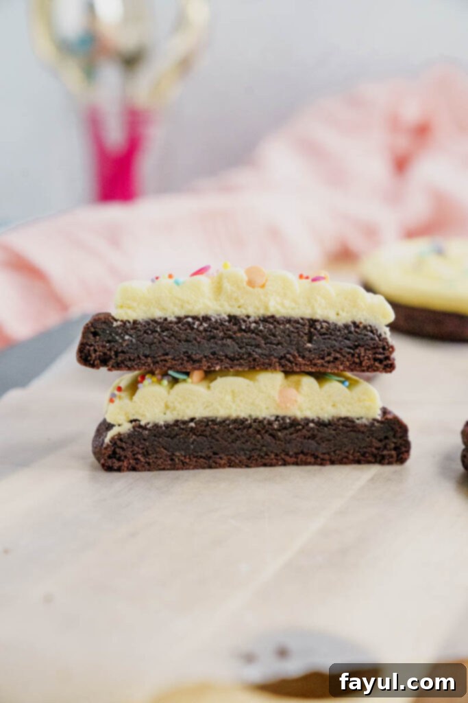 Stack of rich chocolate birthday batter cookies with frosting