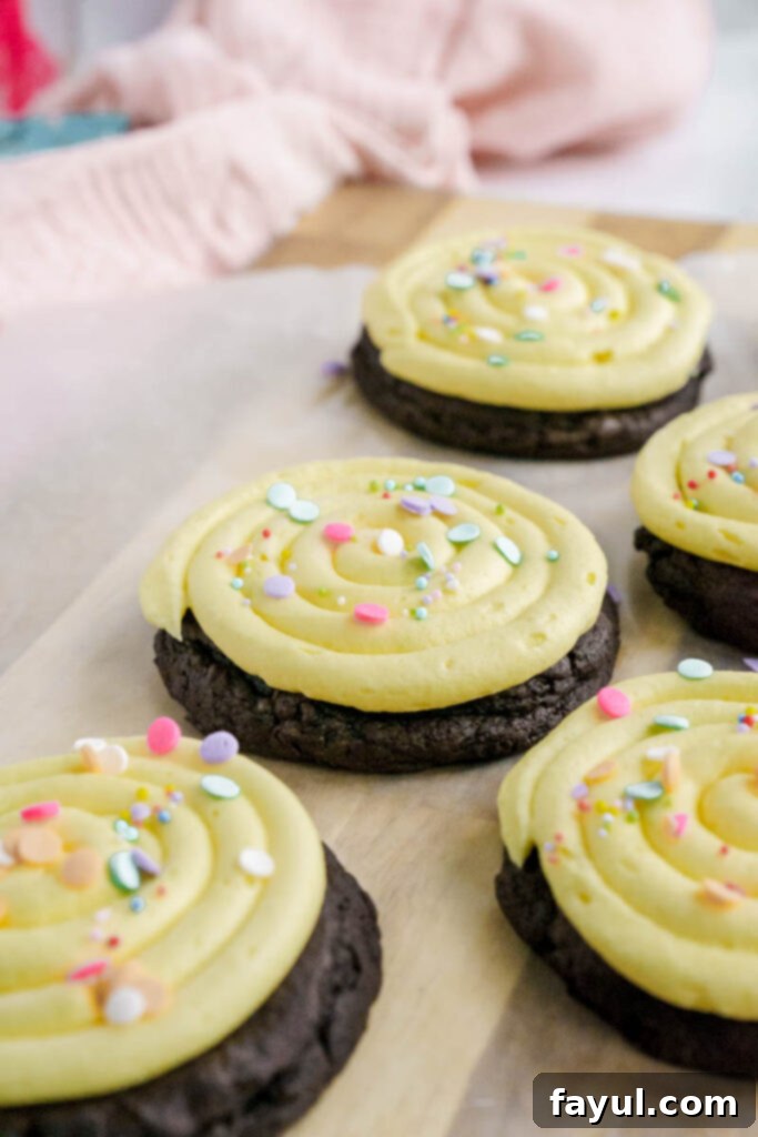 Batch of unfrosted chocolate birthday cookies on a cooling rack