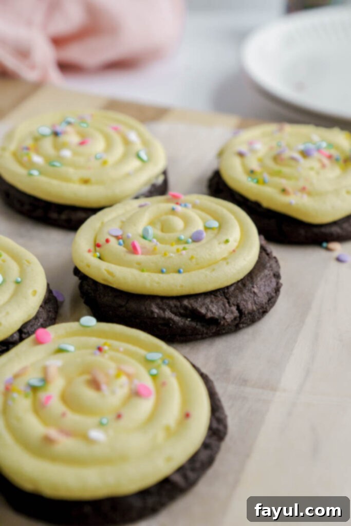 Two Frosted Chocolate Birthday Cookies presented on a plate