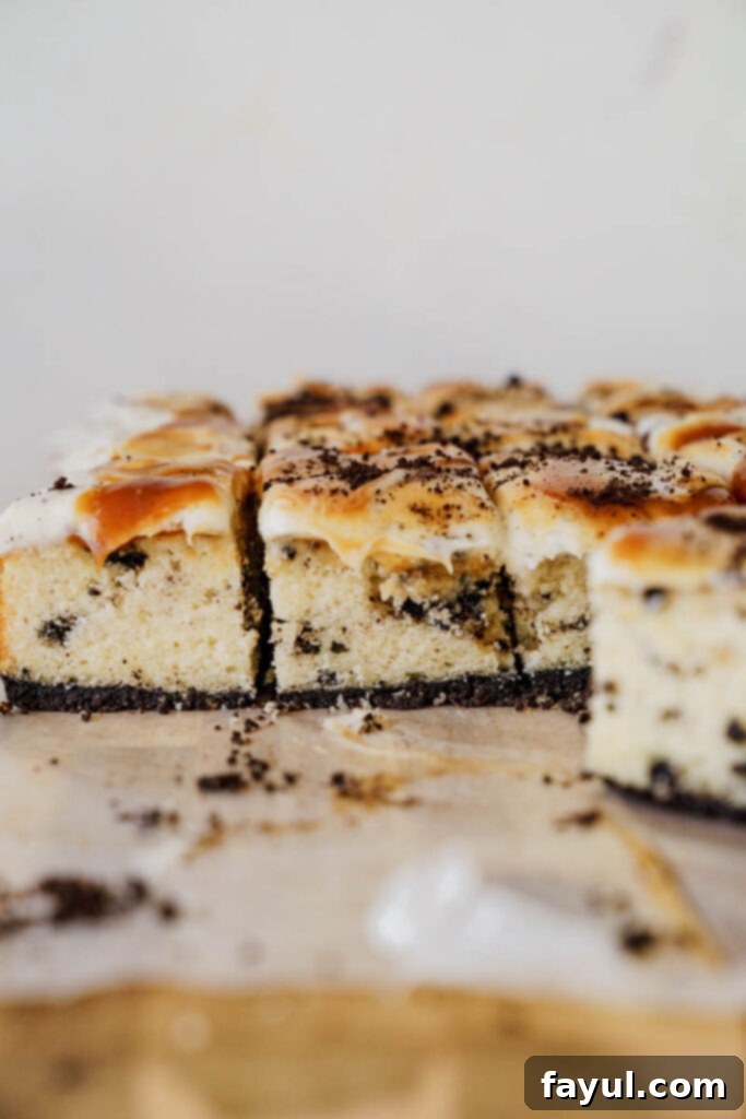 Oreo Caramel Cake with a large slice cut out