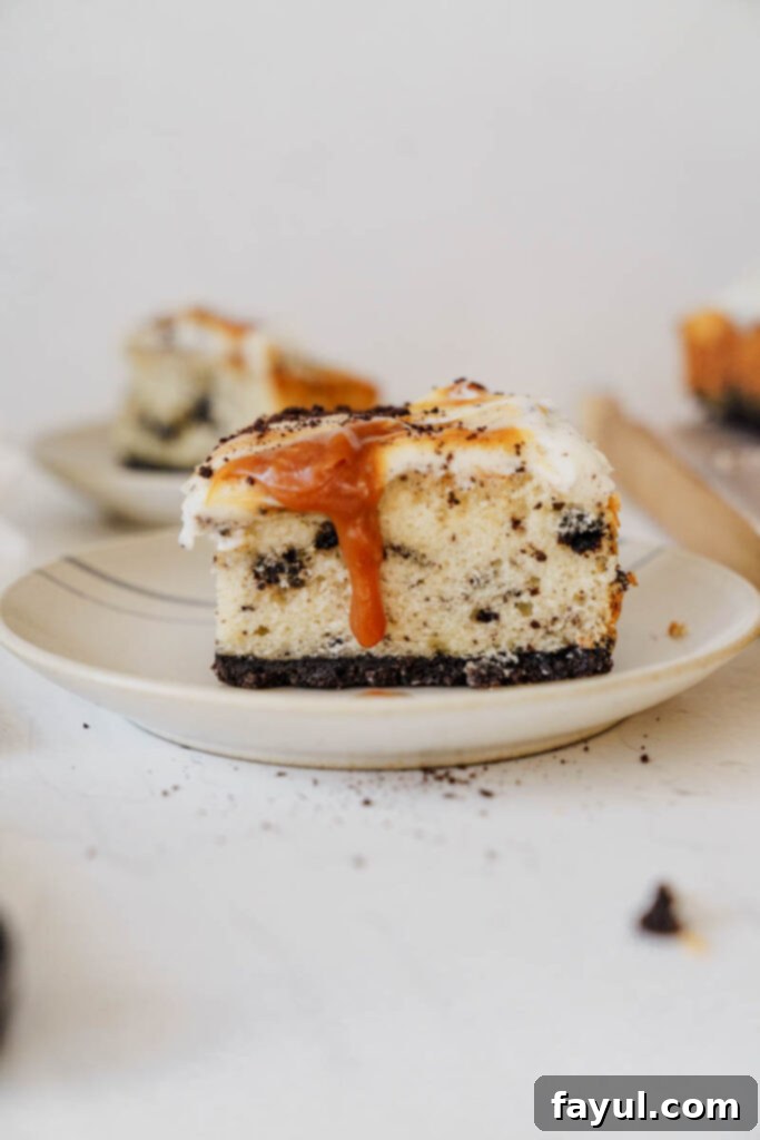 Oreo Caramel Cake with a scoop taken out