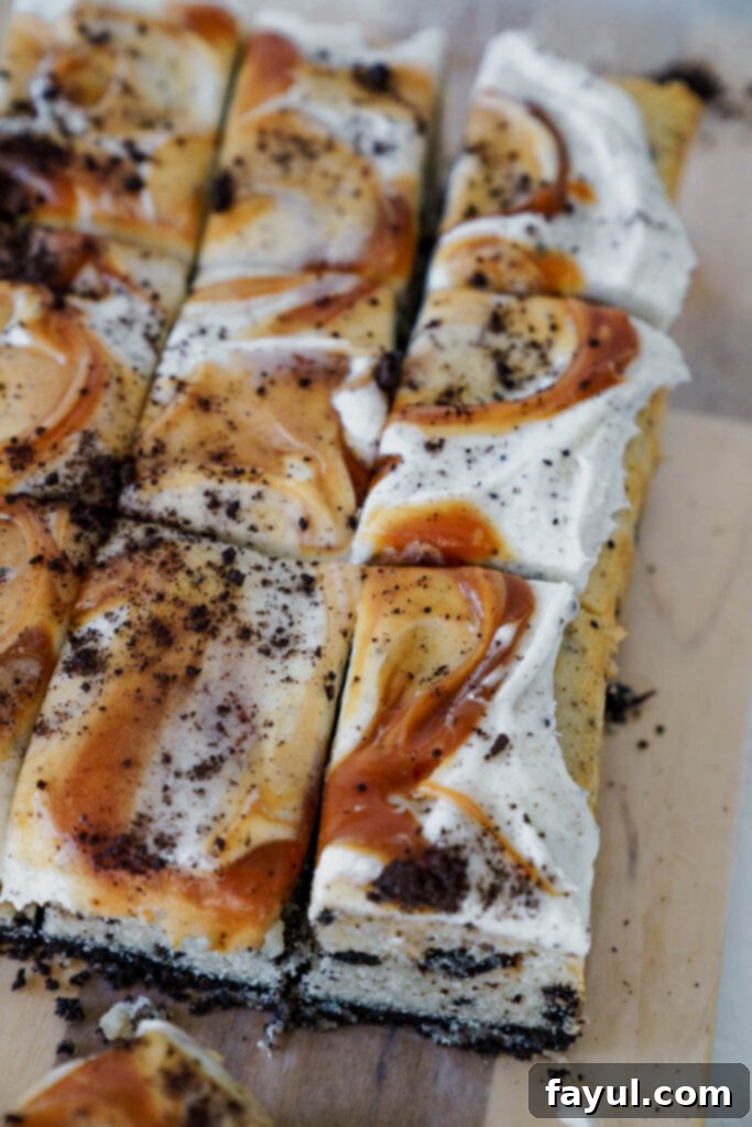Caramel Sauce being drizzled on Oreo Caramel Cake