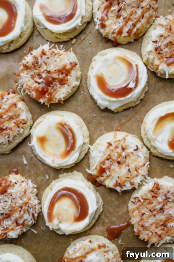 Close-up of a single frosted coconut caramel sugar cookie with a caramel swirl