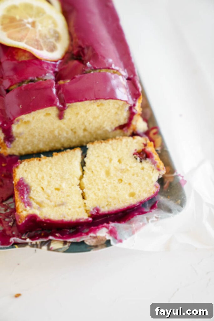 A close-up shot of the vibrant blueberry glaze being prepared in a small saucepan.