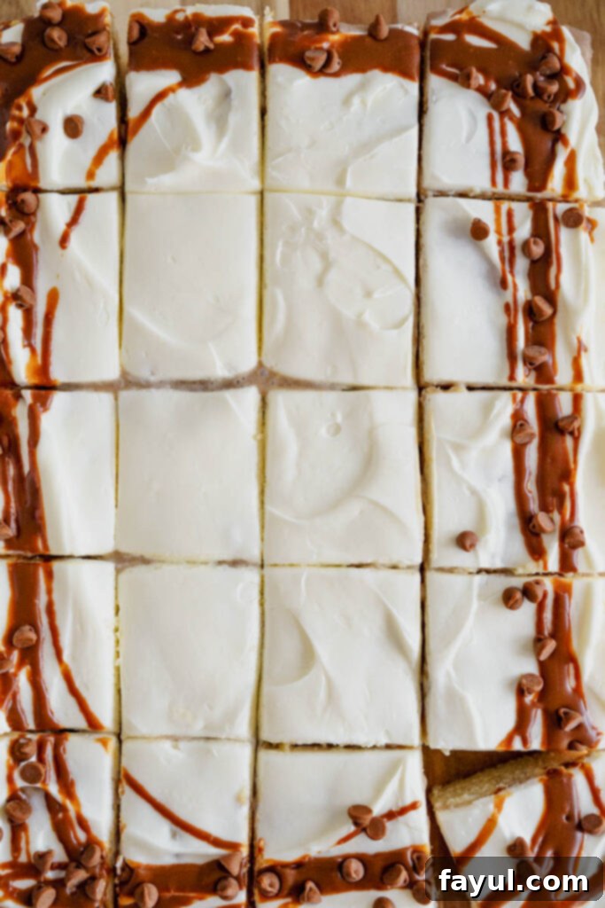 Close-up of Cinnamon Roll Poke Cake showing the moist cake and filling.