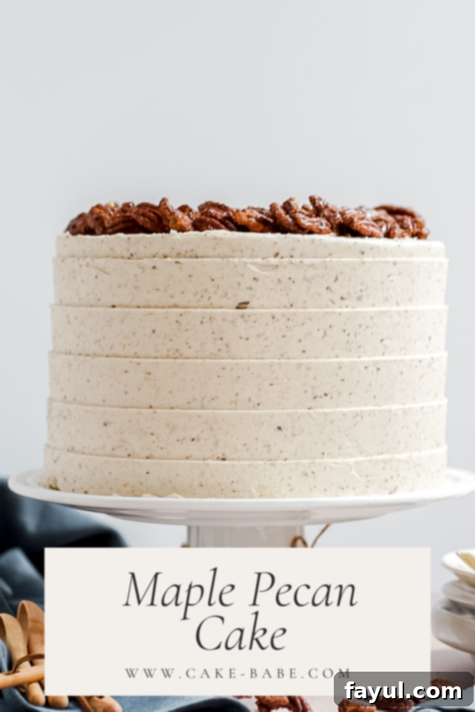 A stunning slice of Maple Pecan Cake showing moist maple layers, pecan crunch, and creamy pecan buttercream, ready for a fall celebration.