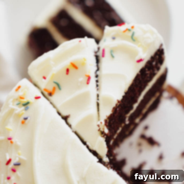 A beautifully frosted chocolate cake with cream cheese frosting, ready to be served.