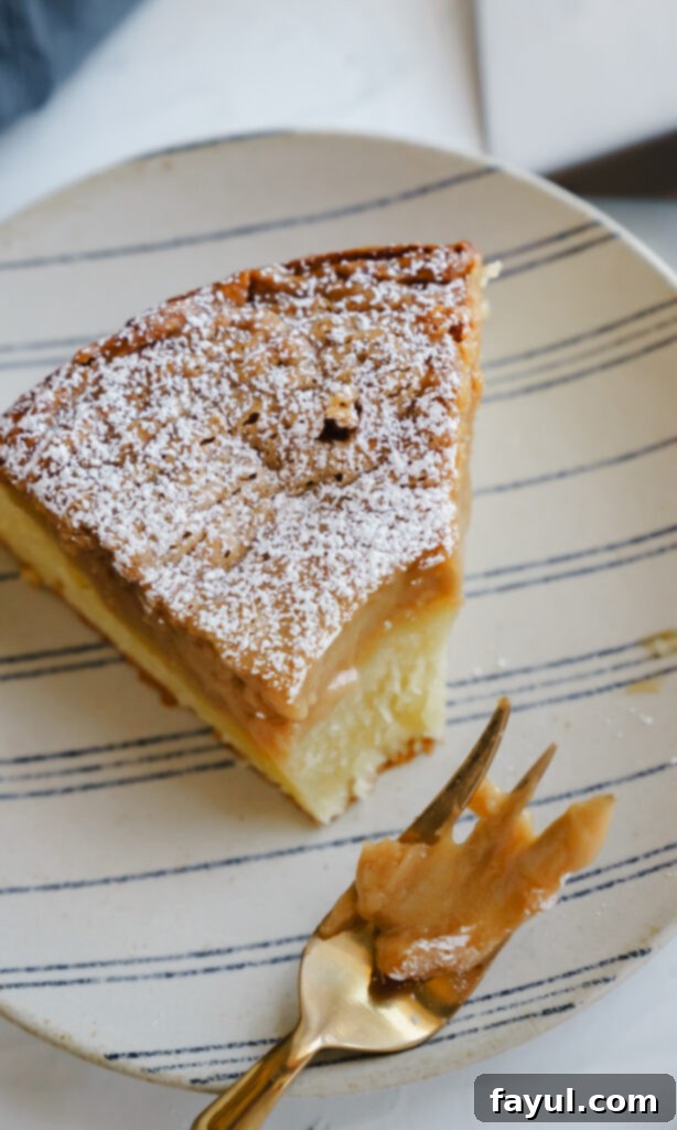 Caramel Gooey Butter Cake with a spoon scooping out a piece