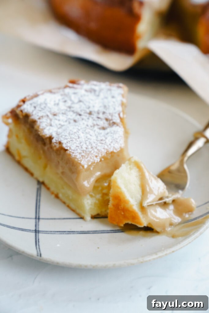 Two pieces of Caramel Gooey Butter Cake on a plate