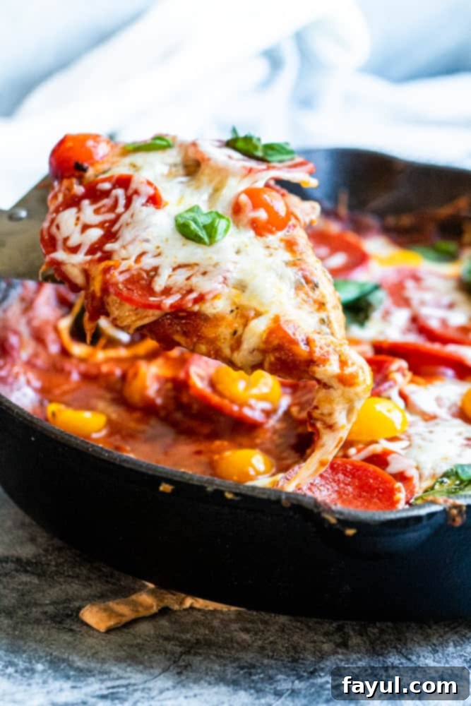 Close-up shot of Skillet Pepperoni Pizza Chicken with basil, ready to be served.