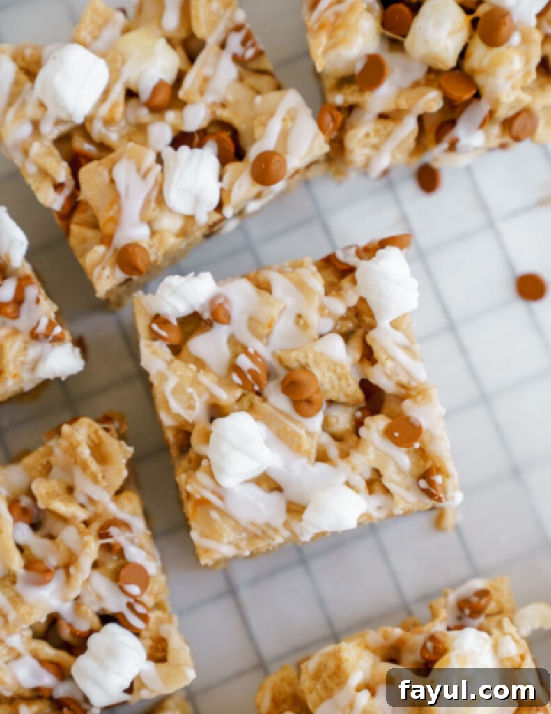 Close up image of mini marshmallows and unsalted butter melting in a pot, the first step to making cereal bars.