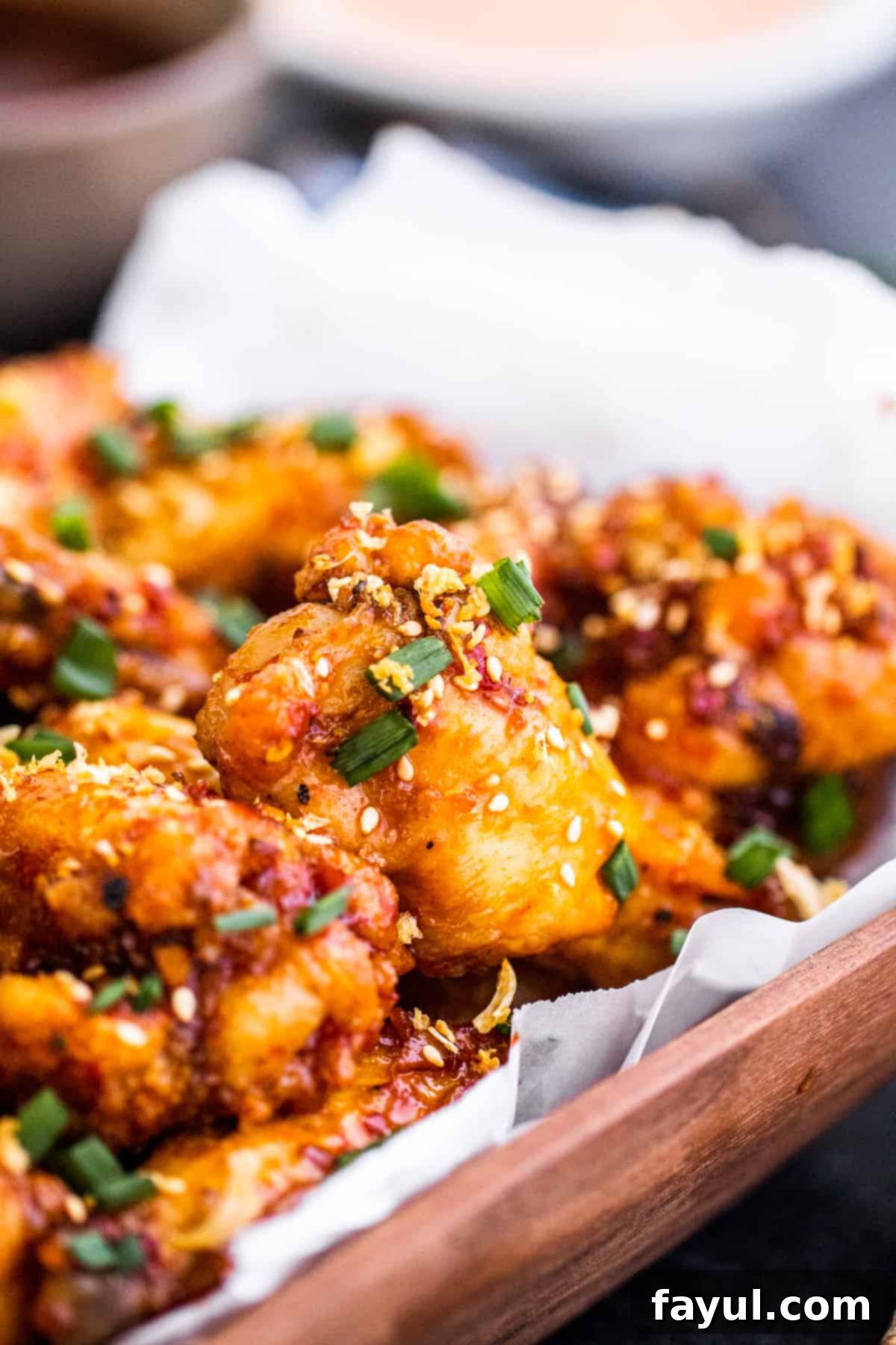 Angle shot close up of bowl of chicken wings.