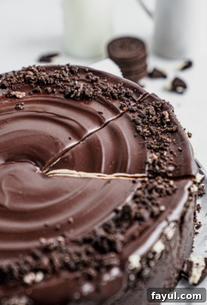 Another angle of the no-bake Oreo cheesecake, showing the ganache drizzle