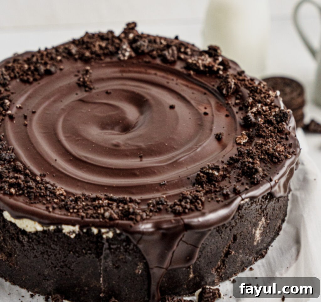 Top-down view of the whole no-bake Oreo cheesecake with ganache and salt