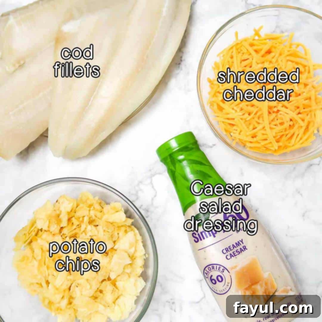 Overhead shot of ingredients for potato crusted cod, including fresh cod fillets, a bottle of Caesar salad dressing, a bag of potato chips, and a bowl of shredded cheddar cheese.