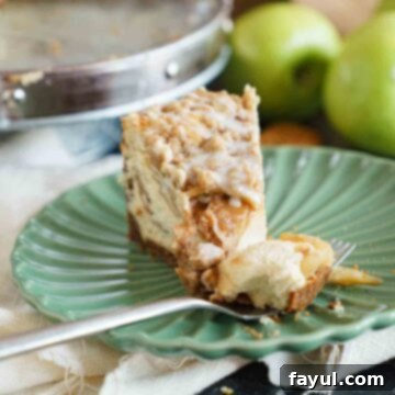 Apple Crisp Cheesecake with a golden streusel topping and creamy filling